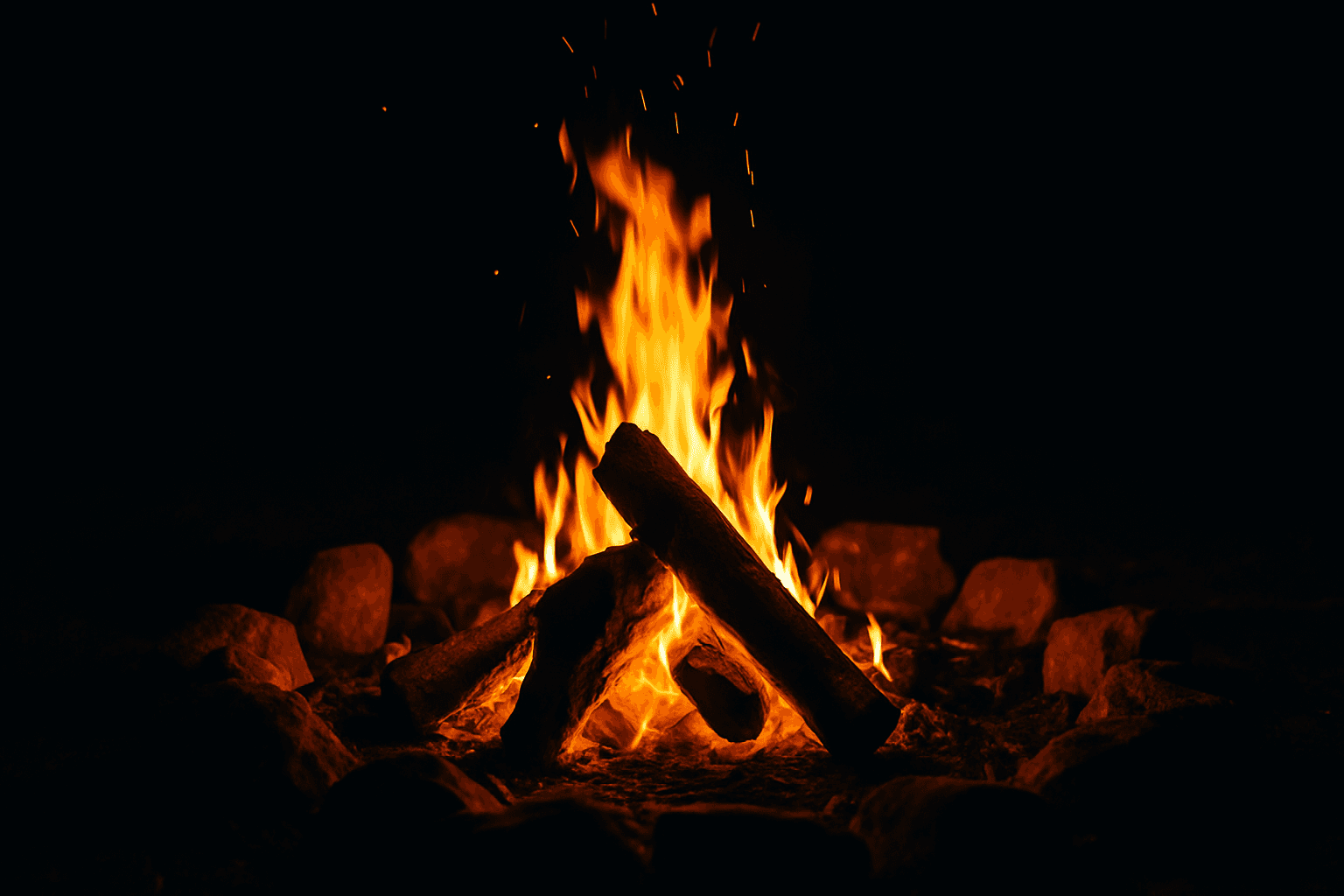 Community gathering around campfire